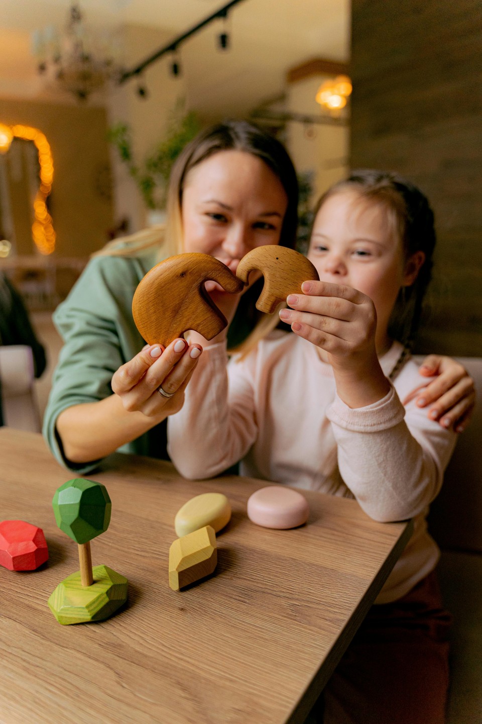 An NDIS participant is engaging in a playful activity with her physiotherapist